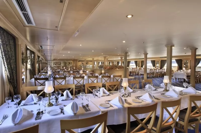 Dining area aboard Iberotel Crown Emperor Nile Cruise set for fine meals